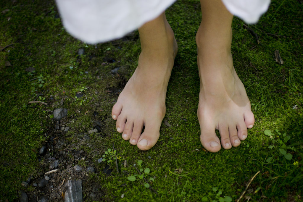 bare feet on the earth