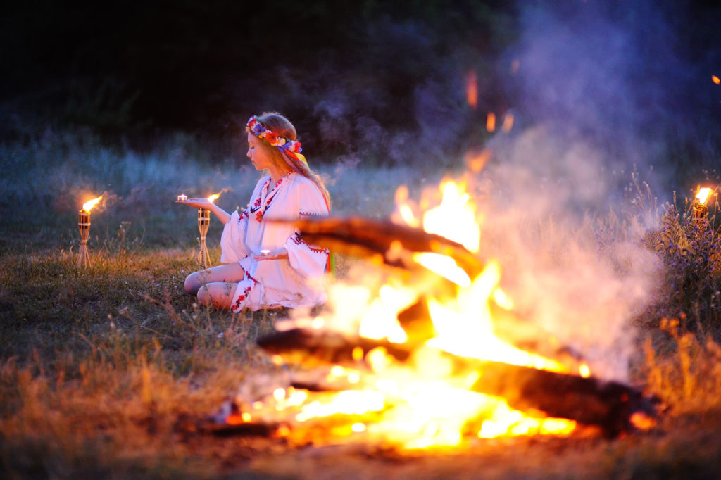 girl performing ritual with fire